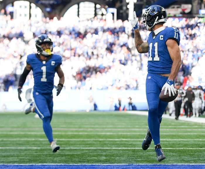 Indianapolis Colts wide receiver Michael Pittman Jr. (11) looks back and throws up a peace sign as he runs into the end zone Sunday, Oct. 22, 2023, during a game against the Cleveland Browns at Lucas Oil Stadium in Indianapolis.